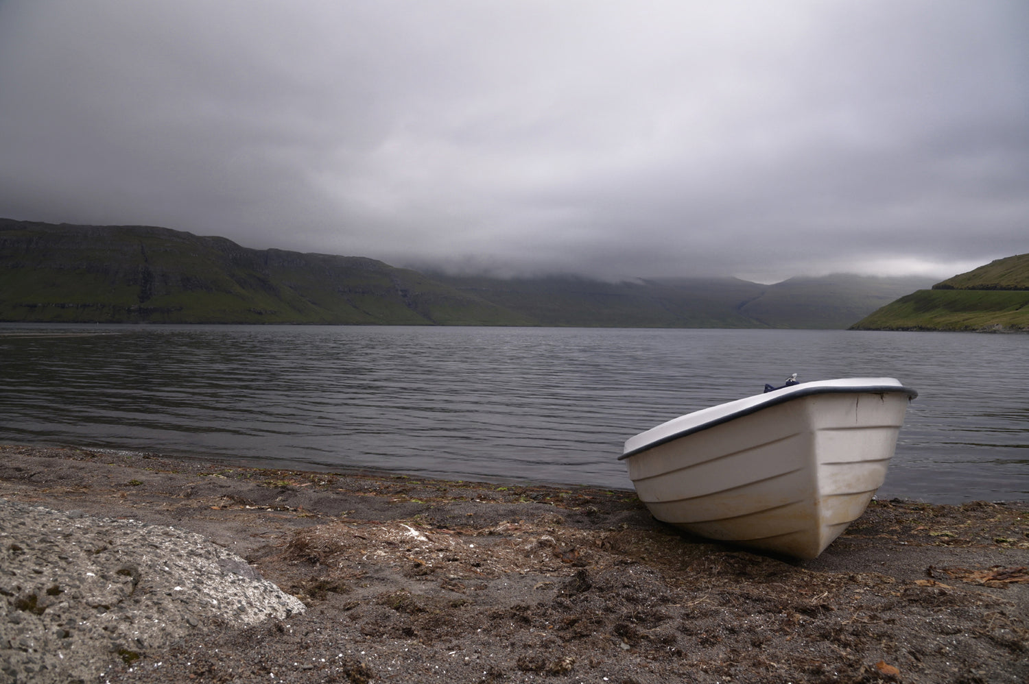 Little white row boat on the Shore of the Faroe Islands. Fine Art Photography. Kristen Olivares