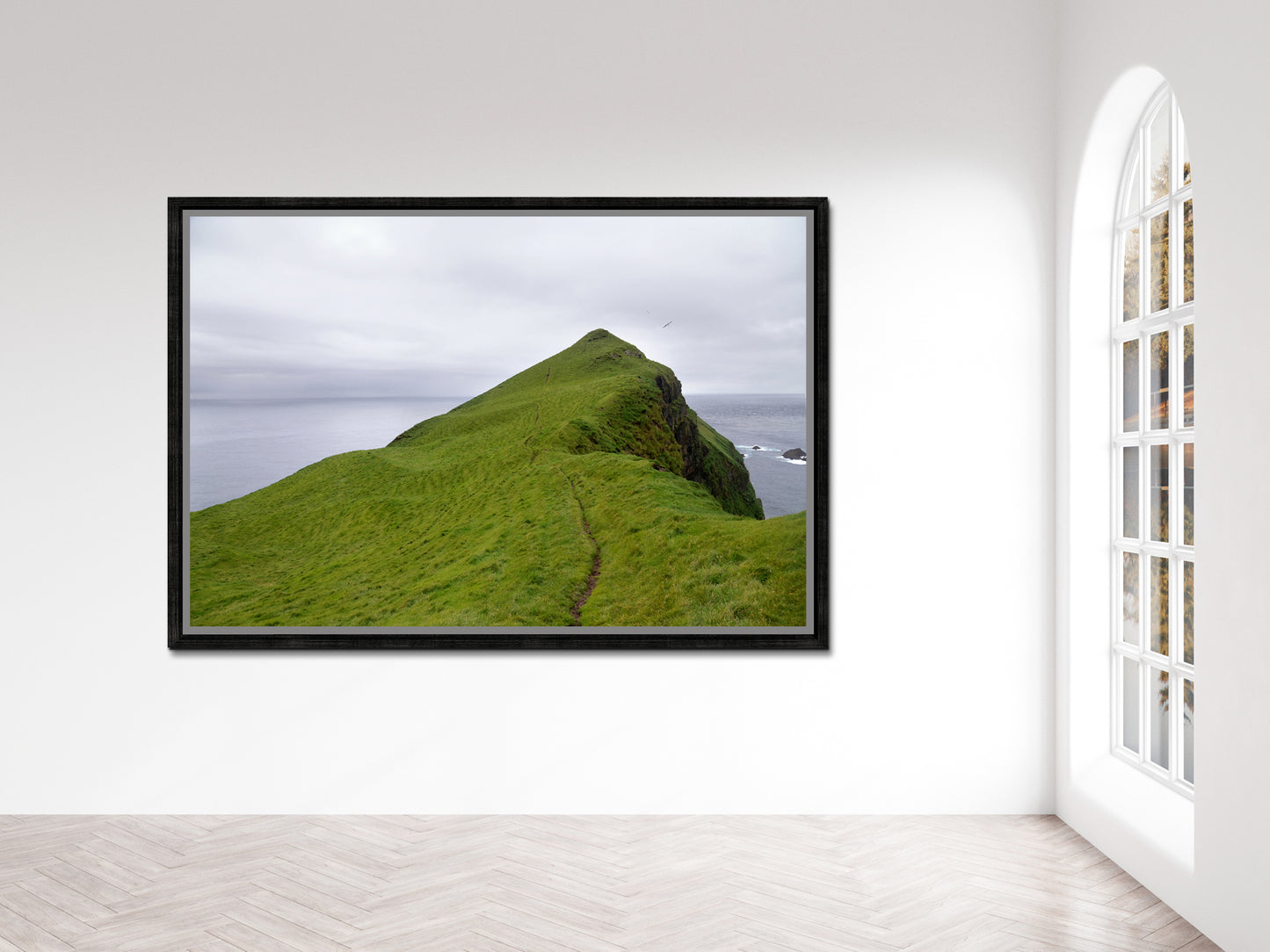 A stunning image of a cliff jetting out into the Atlantic Ocean in the Faroe Islands. Framed fine art photography by Kristen Olivares.