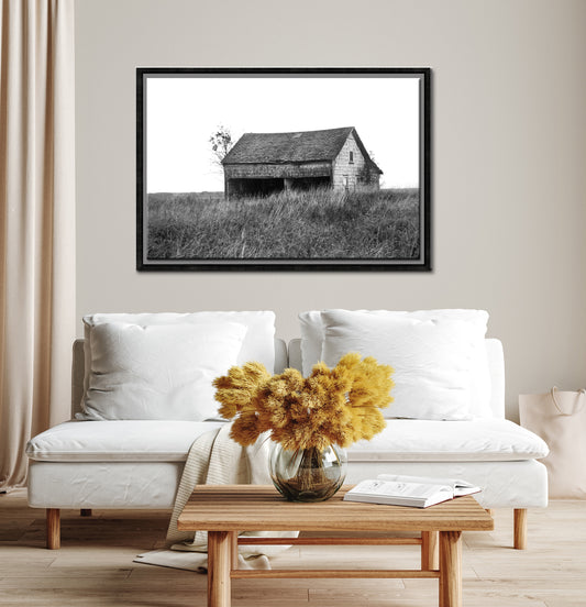 An old abandoned barn off in the desolate fields of Canada. Framed fine art photography by Kristen Olivares.