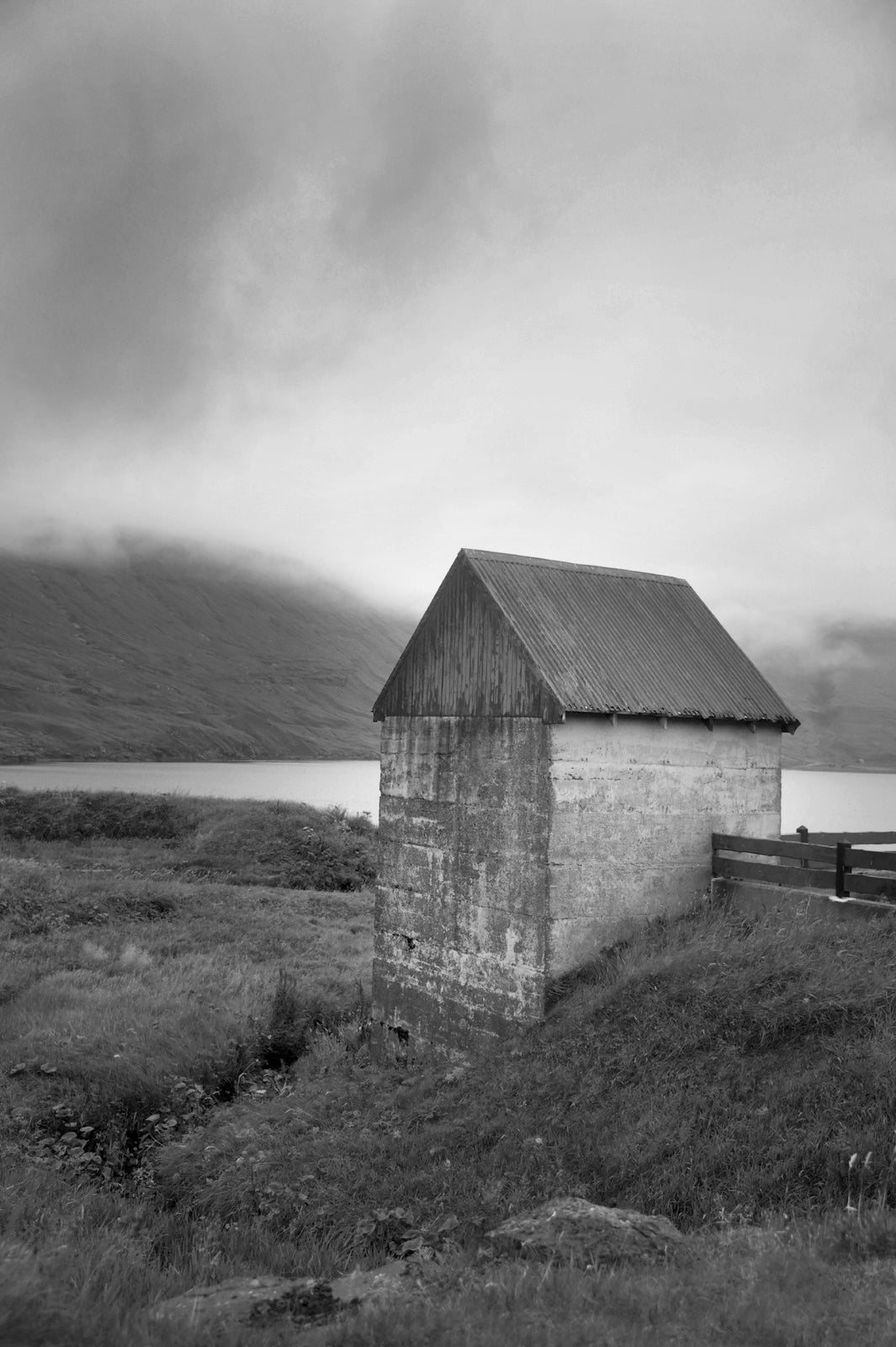 Stunning stone barn on the coast of the Faroe Islands. Fine art print by Kristen Olivares.