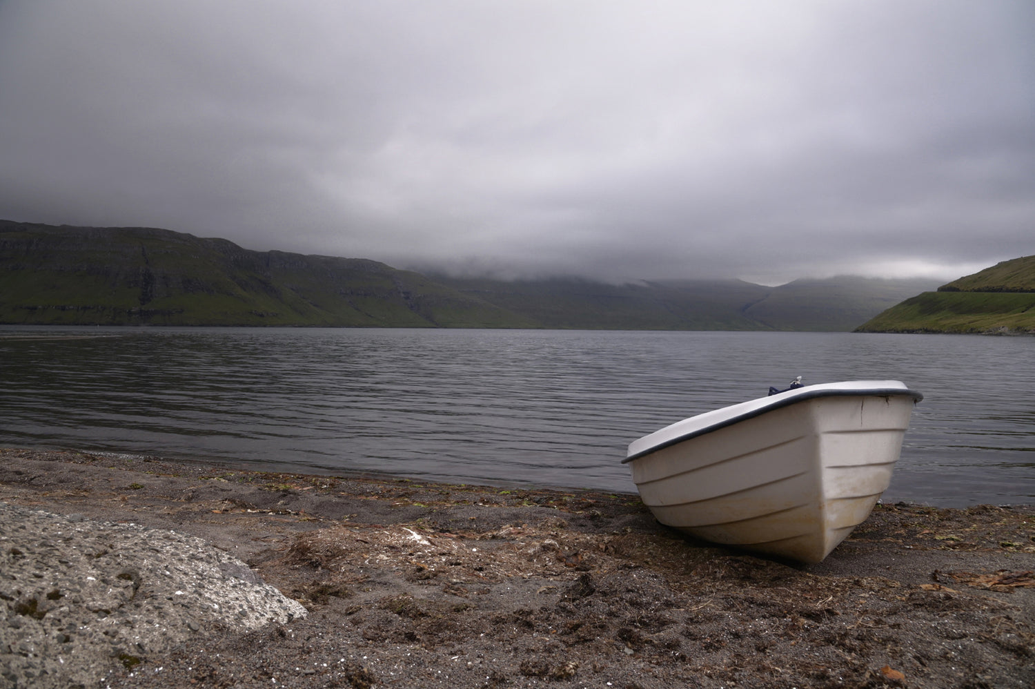 Little white row boat on the Shore of the Faroe Islands.  Fine Art Photography. Kristen Olivares
