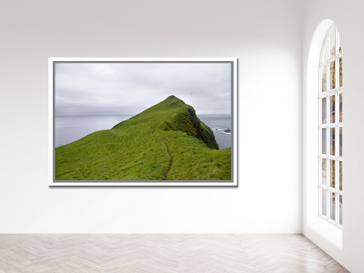 A stunning image of a cliff jetting out into the Atlantic Ocean in the Faroe Islands. Framed fine art photography by Kristen Olivares.