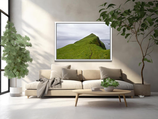 A stunning image of a cliff jetting out into the Atlantic Ocean in the Faroe Islands. Framed fine art photography by Kristen Olivares.