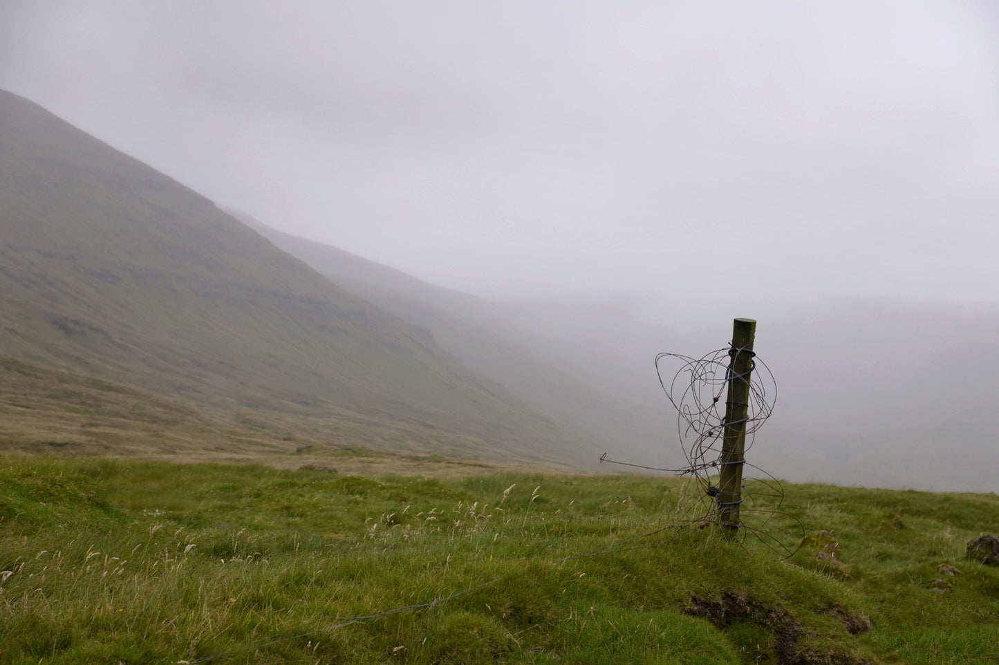 Broken fence on the foggy land of the Faroe Islands.  Fine Art Photography. Kristen Olivares