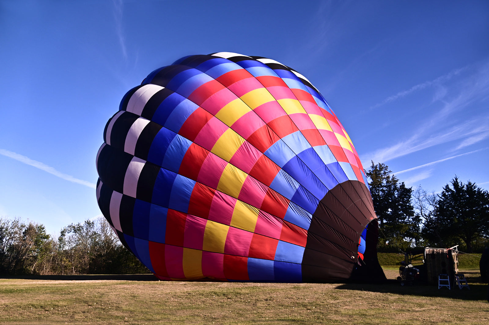 Brightly colored hot air balloon ready for flight. Framed canvas print by Kristen Olivares