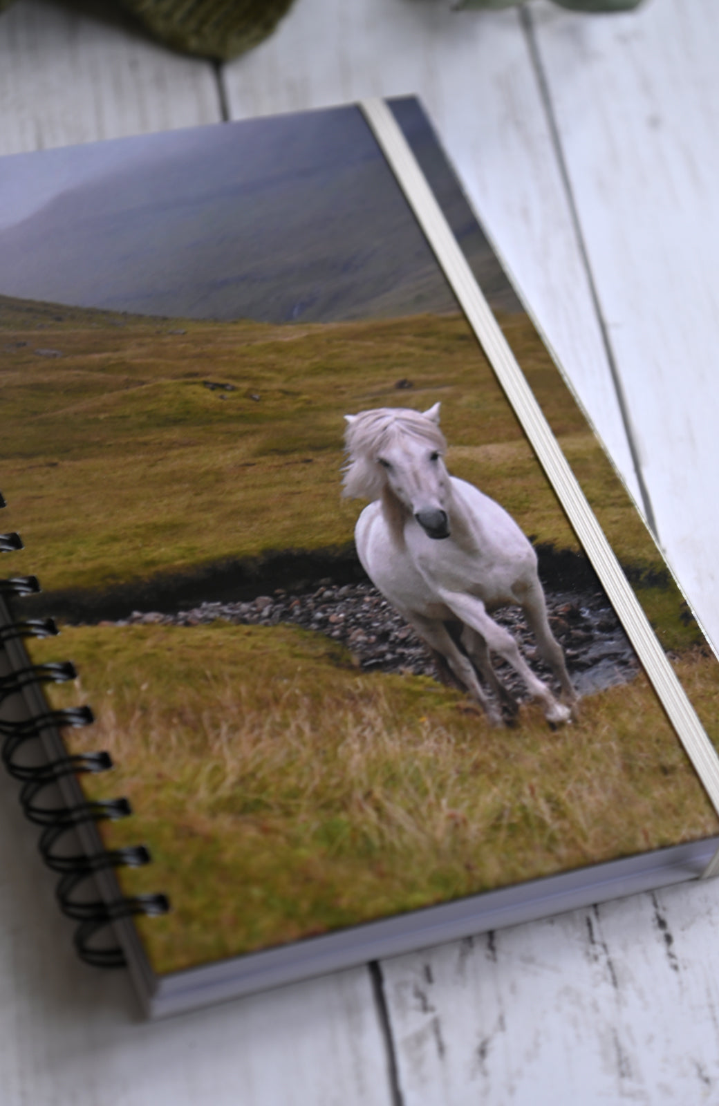 Beautiful photo of a white wild horse running through the misty cliffs of the Faroe Islands. Durable hardcover journal-200 lined pages- photo by Kristen Olivares