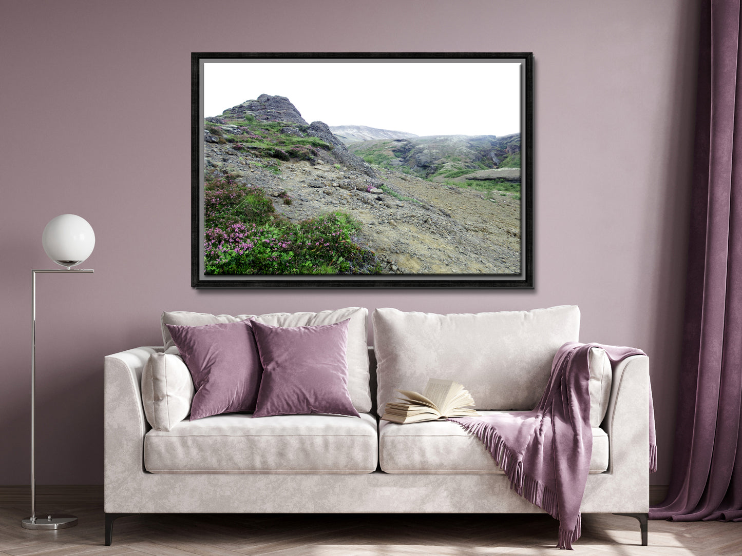 Icelands rough, rugged landscape with delicate pink flowers growing along side the rocky land. Framed fine art photography by Kristen Olivares. 