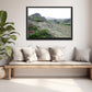 Icelands rough, rugged landscape with delicate pink flowers growing along side the rocky land. Framed fine art photography by Kristen Olivares. 