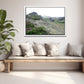 Icelands rough, rugged landscape with delicate pink flowers growing along side the rocky land. Framed fine art photography by Kristen Olivares. 