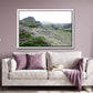 Icelands rough, rugged landscape with delicate pink flowers growing along side the rocky land. Framed fine art photography by Kristen Olivares. 