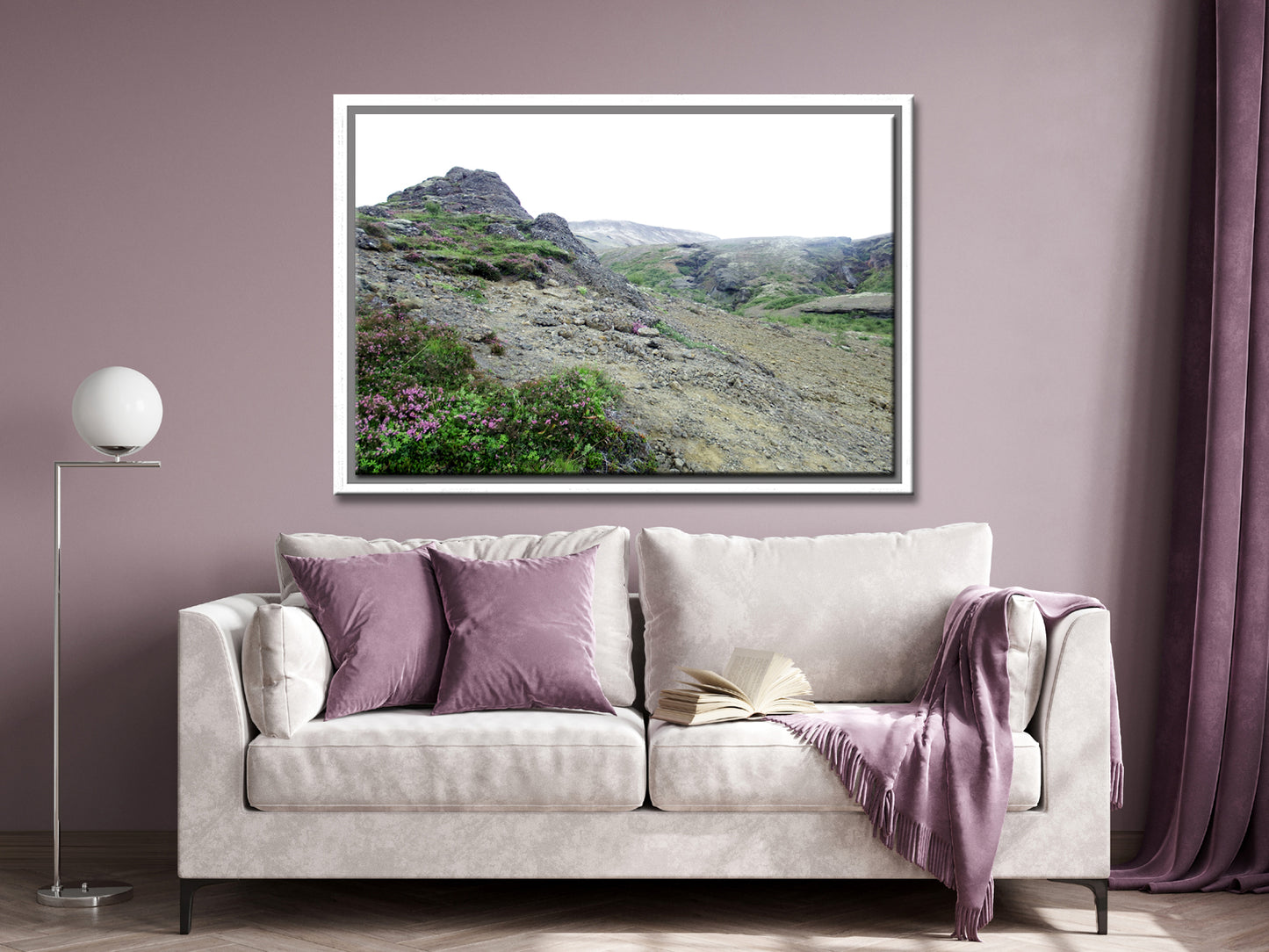 Icelands rough, rugged landscape with delicate pink flowers growing along side the rocky land. Framed fine art photography by Kristen Olivares. 