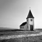 A beautiful church set out in a quiet setting in Iceland. Black and white photo. Canvas wall art by Kristen Oliavres