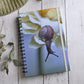 Beautiful photo of a Brown snail crawling on a cream flower. Durable hardcover journal-200 lined pages- photo by Kristen Olivares
