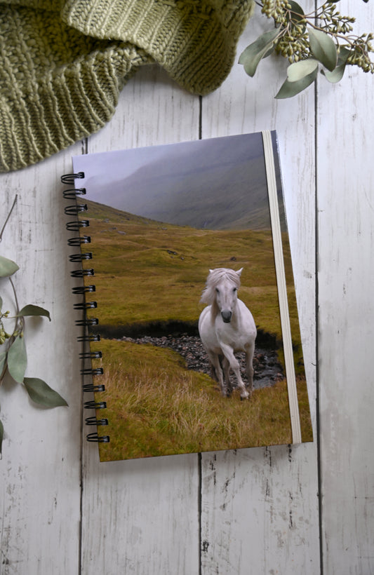 Beautiful photo of a white wild horse running through the misty cliffs of the Faroe Islands. Durable hardcover journal-200 lined pages- photo by Kristen Olivares