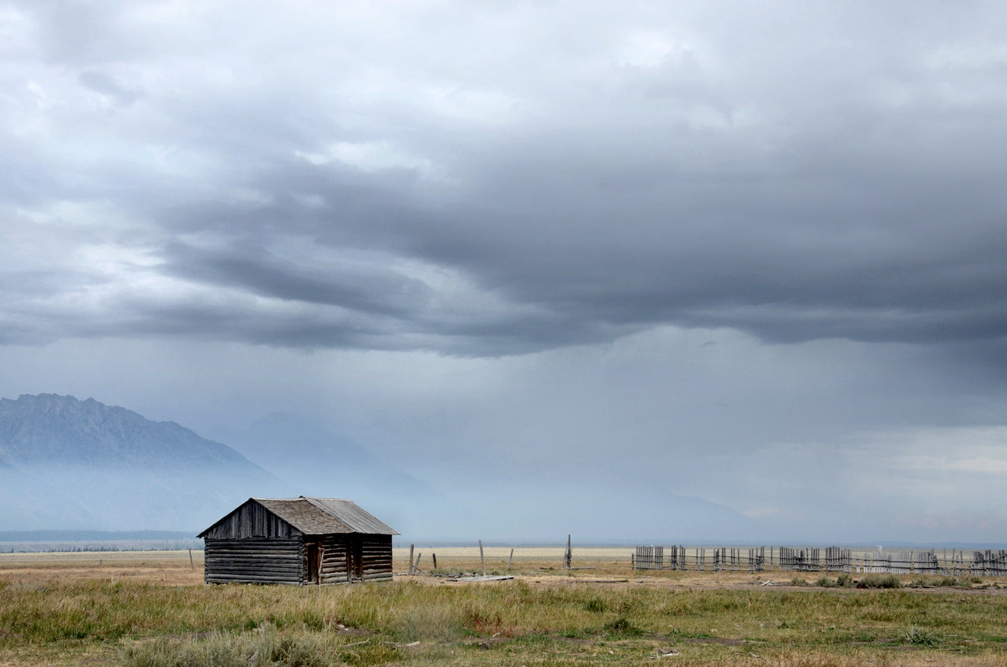 Little log cabin tucked away among the stunning Grand Teton mountains. Canvas Wall Art Framed Fine Art photography by Kristen Olivares.