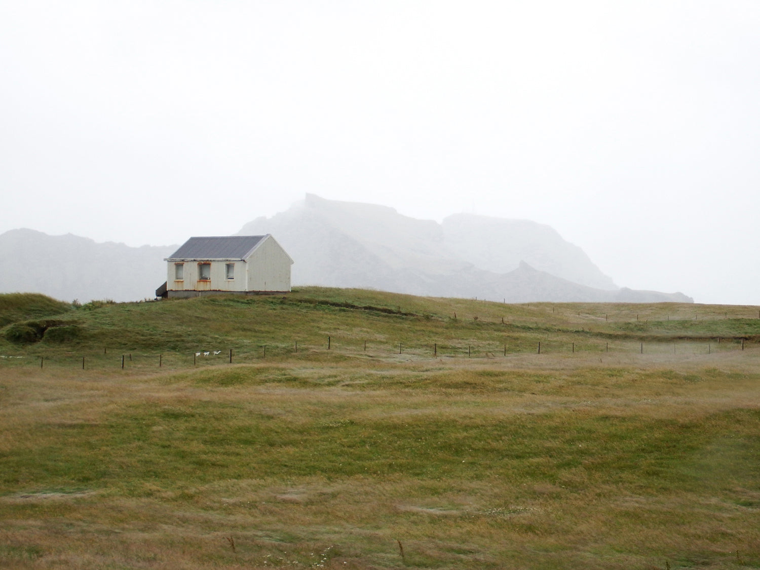 Tiny home on the coastal cliff of Iceland.  Fine Art Photography. Kristen Olivares