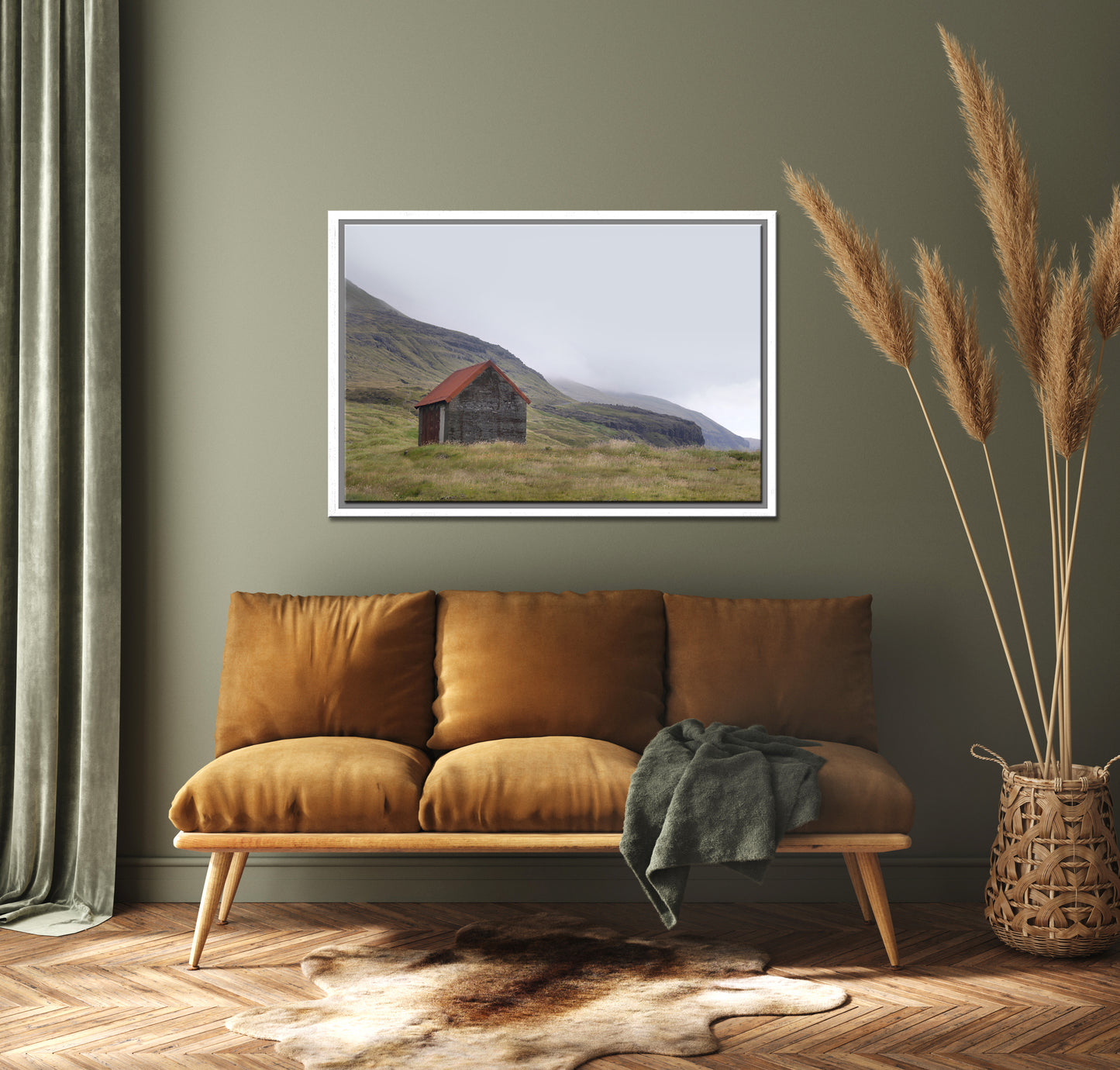 An old stone shack with a rusty colored roof set in the desolate foggy land of the Faroe Islands. Framed fine art photography by Kristen Olivares.