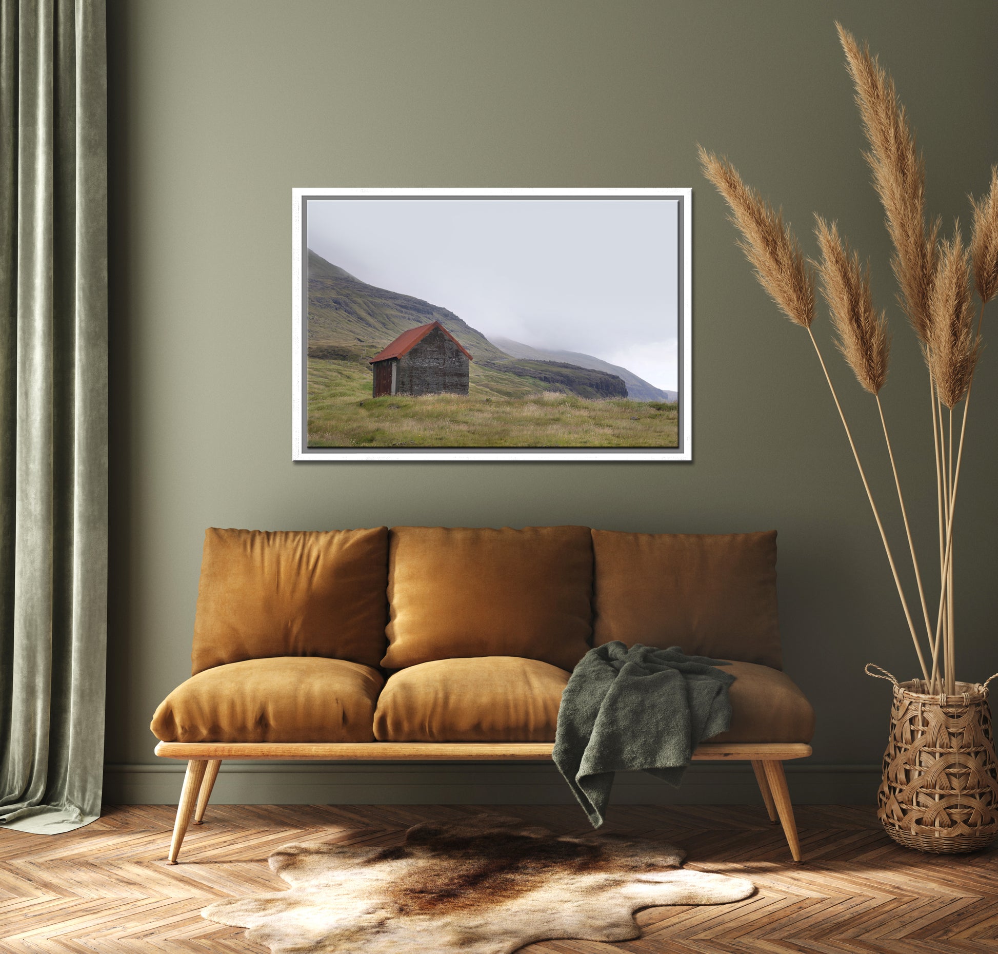 An old stone shack with a rusty colored roof set in the desolate foggy land of the Faroe Islands. Framed fine art photography by Kristen Olivares.