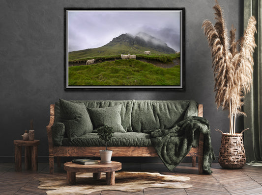 Sheep gathering at the base of a beautiful foggy cliff in the Faroe Islands. Framed fine art photography by Kristen Olivares.