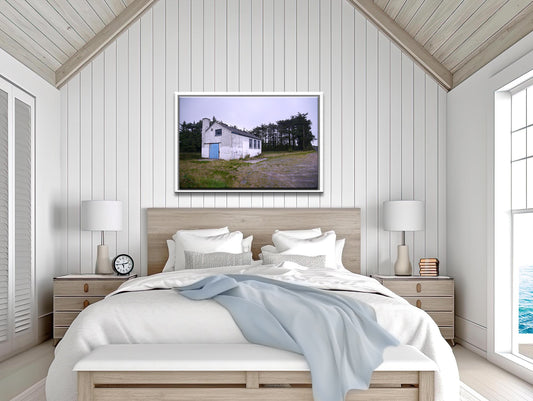 A photo of a stone white house in Ireland with a blue door. Framed canvas print by Kristen Olivares