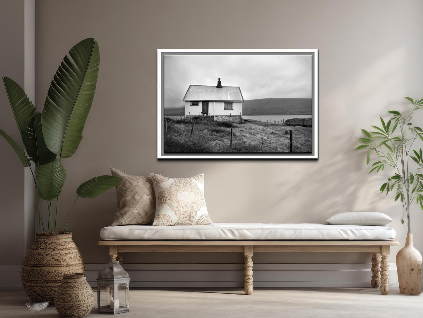 Black and white image of an old house tucked away in the Faroe Islands. Framed fine art photography by Kristen Olivares