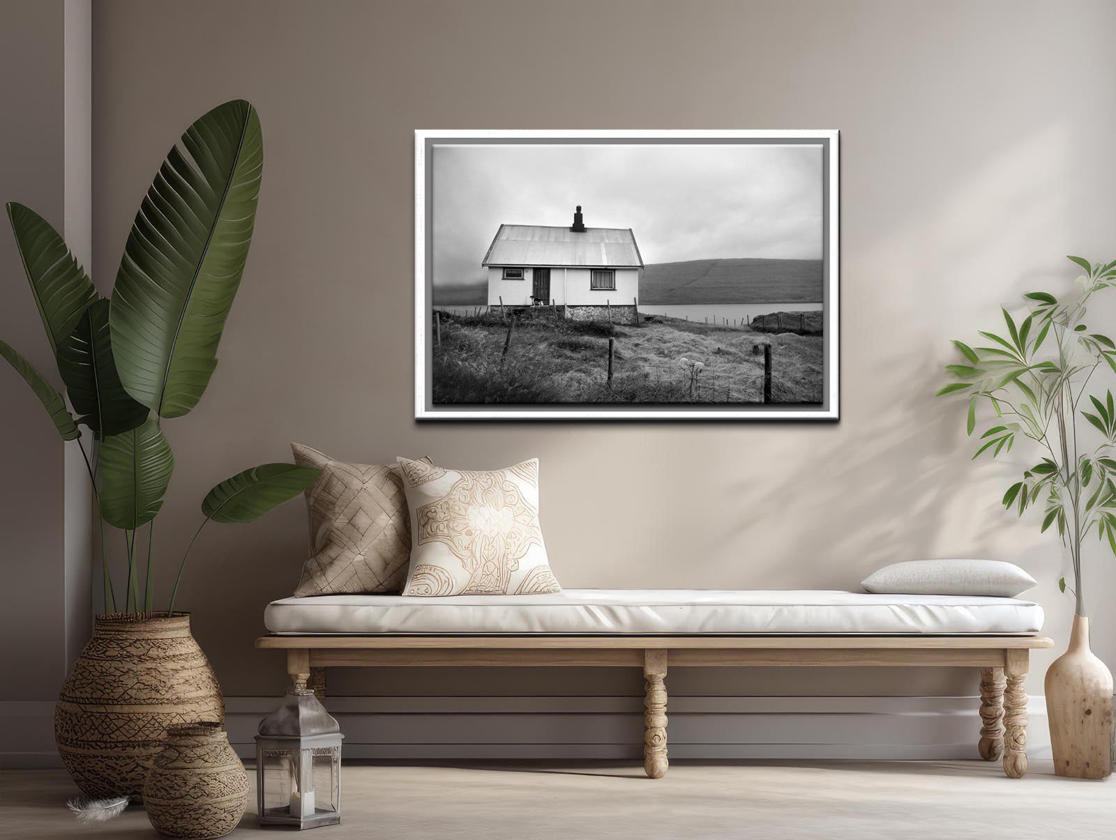 Black and white image of an old house tucked away in the Faroe Islands. Framed fine art photography by Kristen Olivares