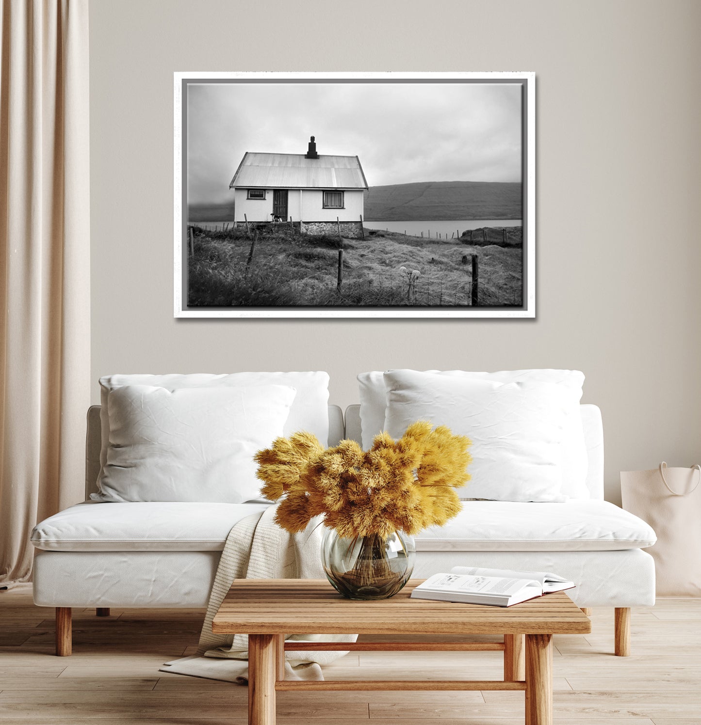 Black and white image of an old house tucked away in the Faroe Islands. Framed fine art photography by Kristen Olivares