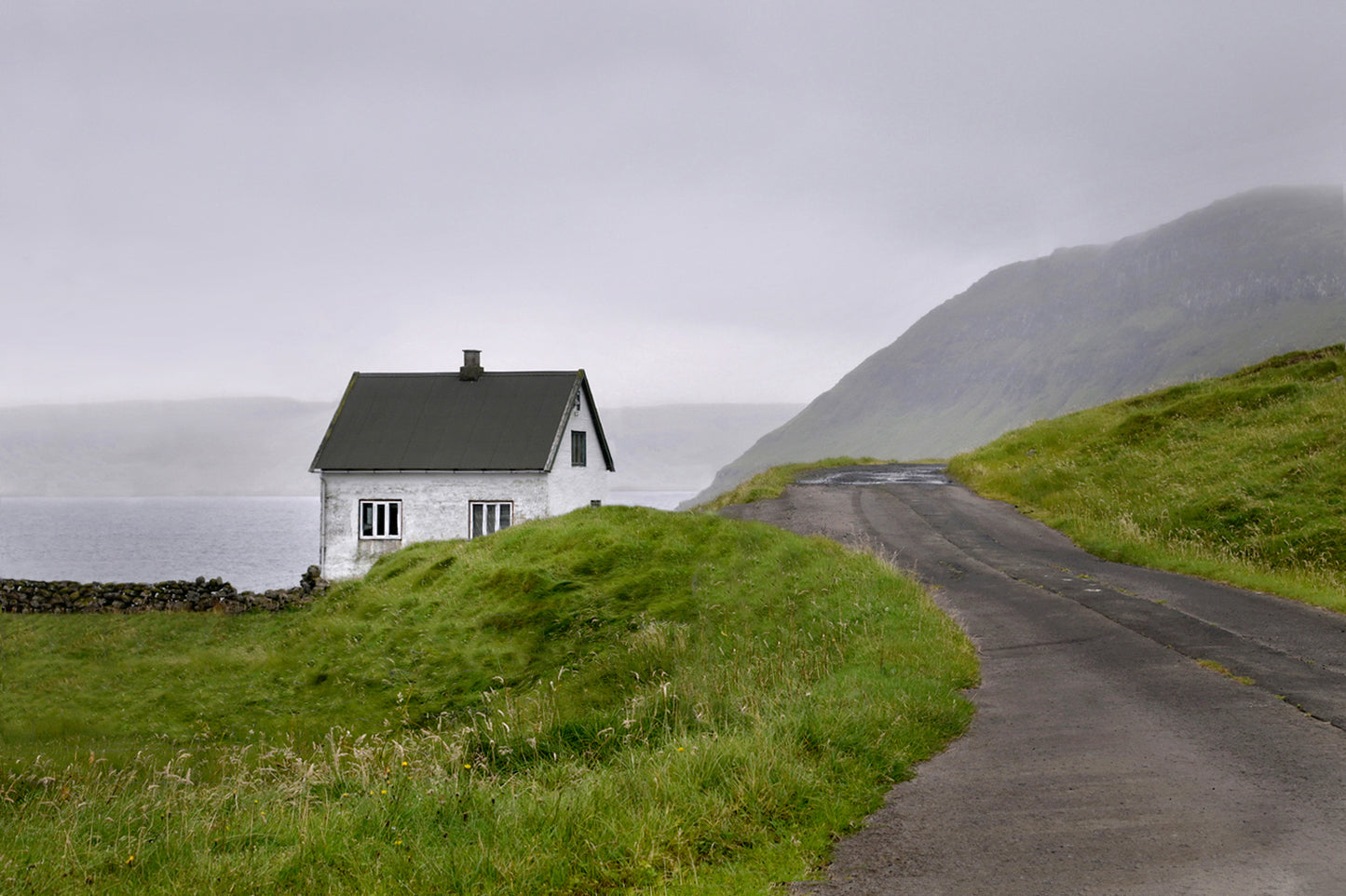 Beautiful, tiny white concrete home in the Faroe Islands. Fine art photography by Kristen Olivares.