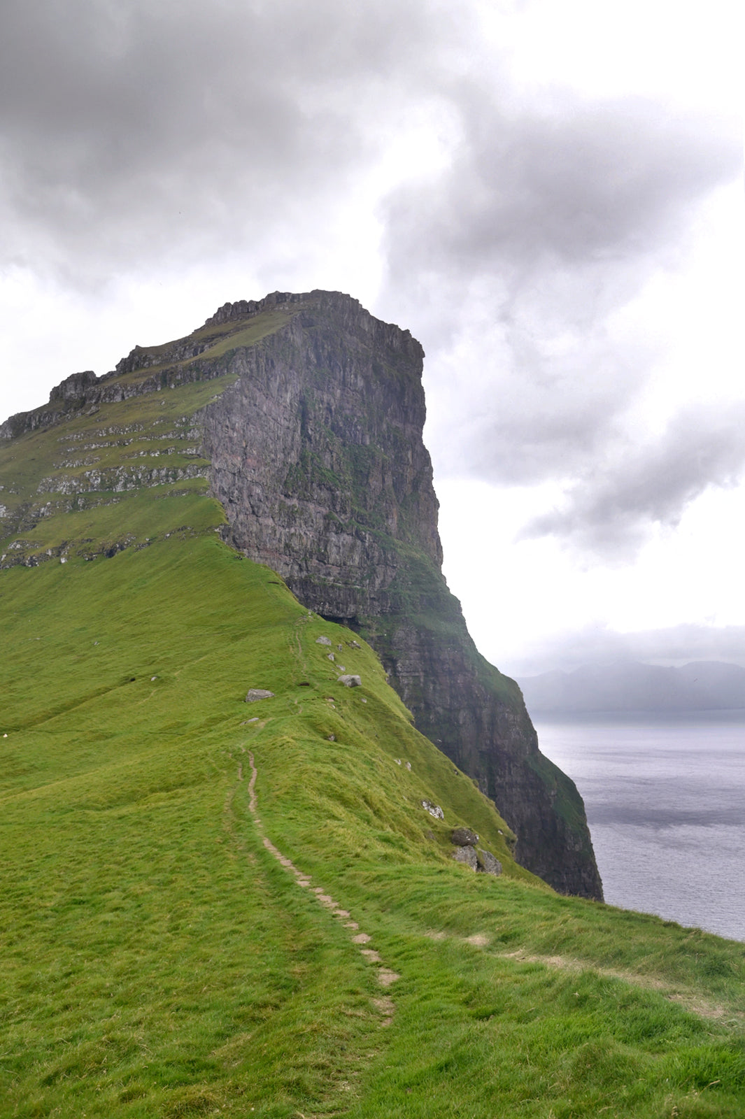 Beautiful towering cliffs of the Faroe Islands on the island of Kalsoy. Canvas wall art. Framed fine art photography by Kristen Olivares. 