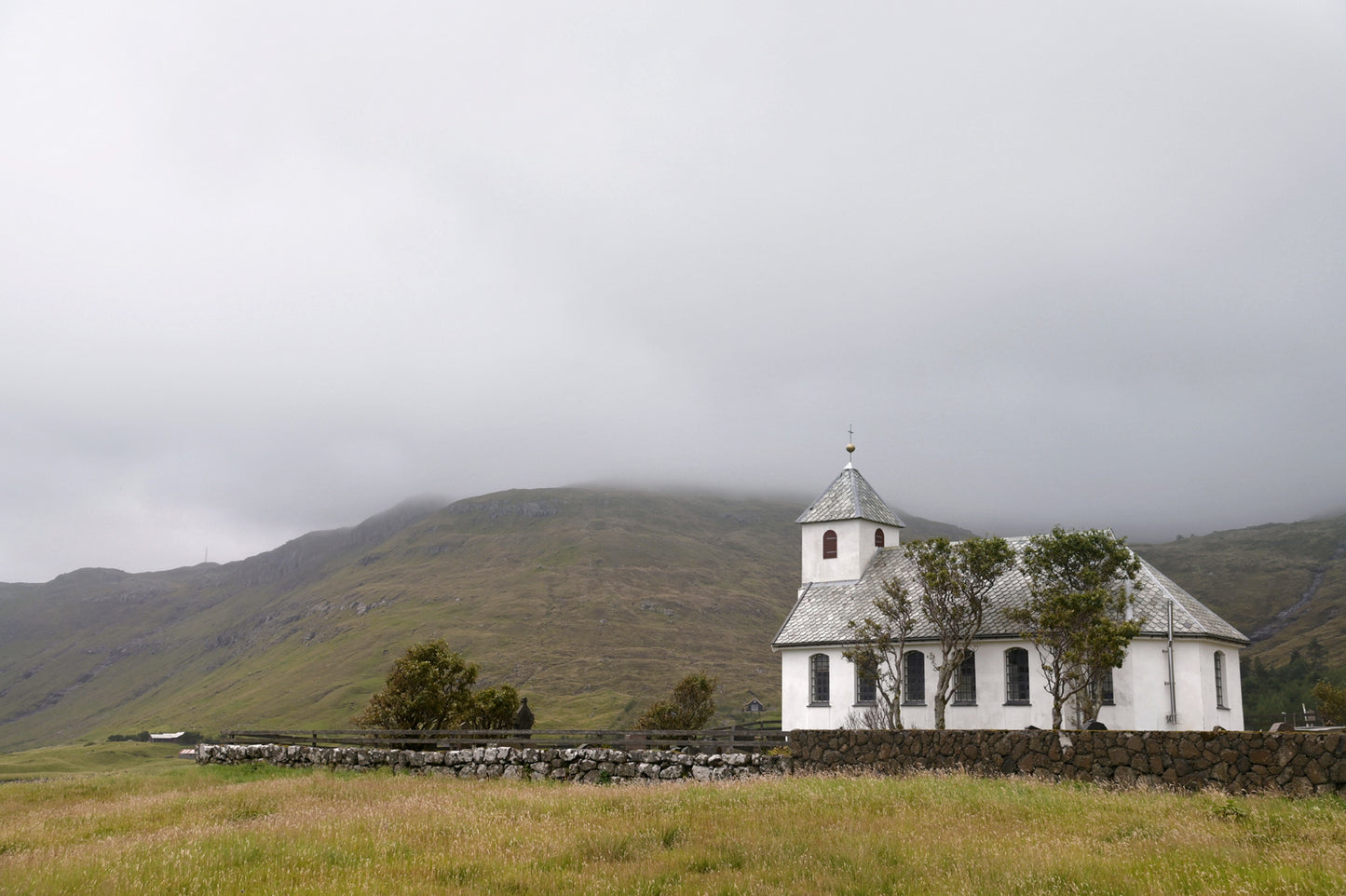Beautiful white church in the Faore Islands. Framed fine art photography by Kristen Olivares.